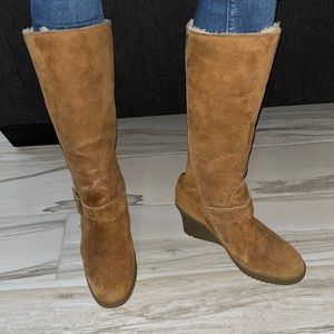 Tan suede UGG boots with side buckle